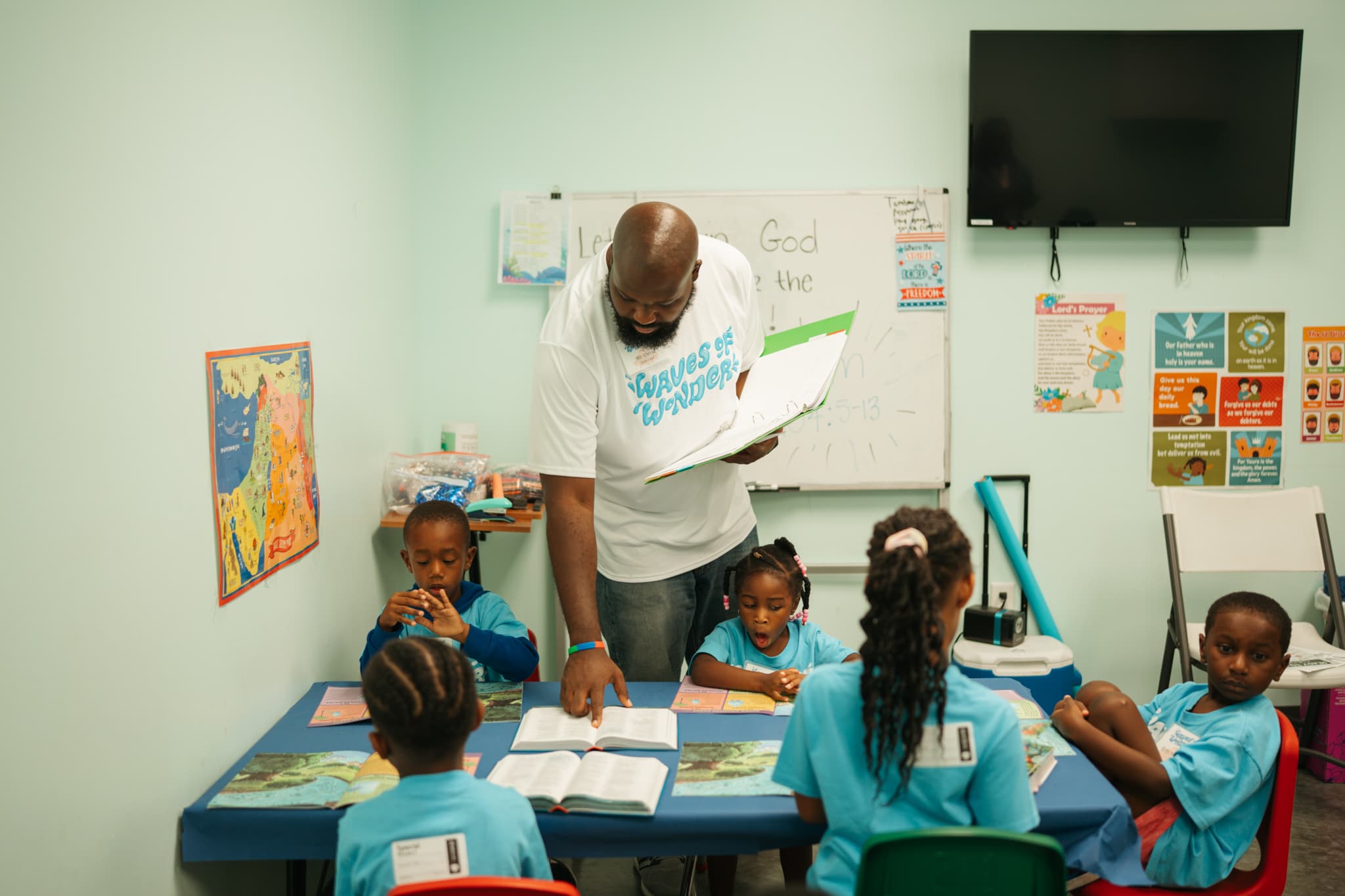 Bible lesson with teacher at Christian summer camp