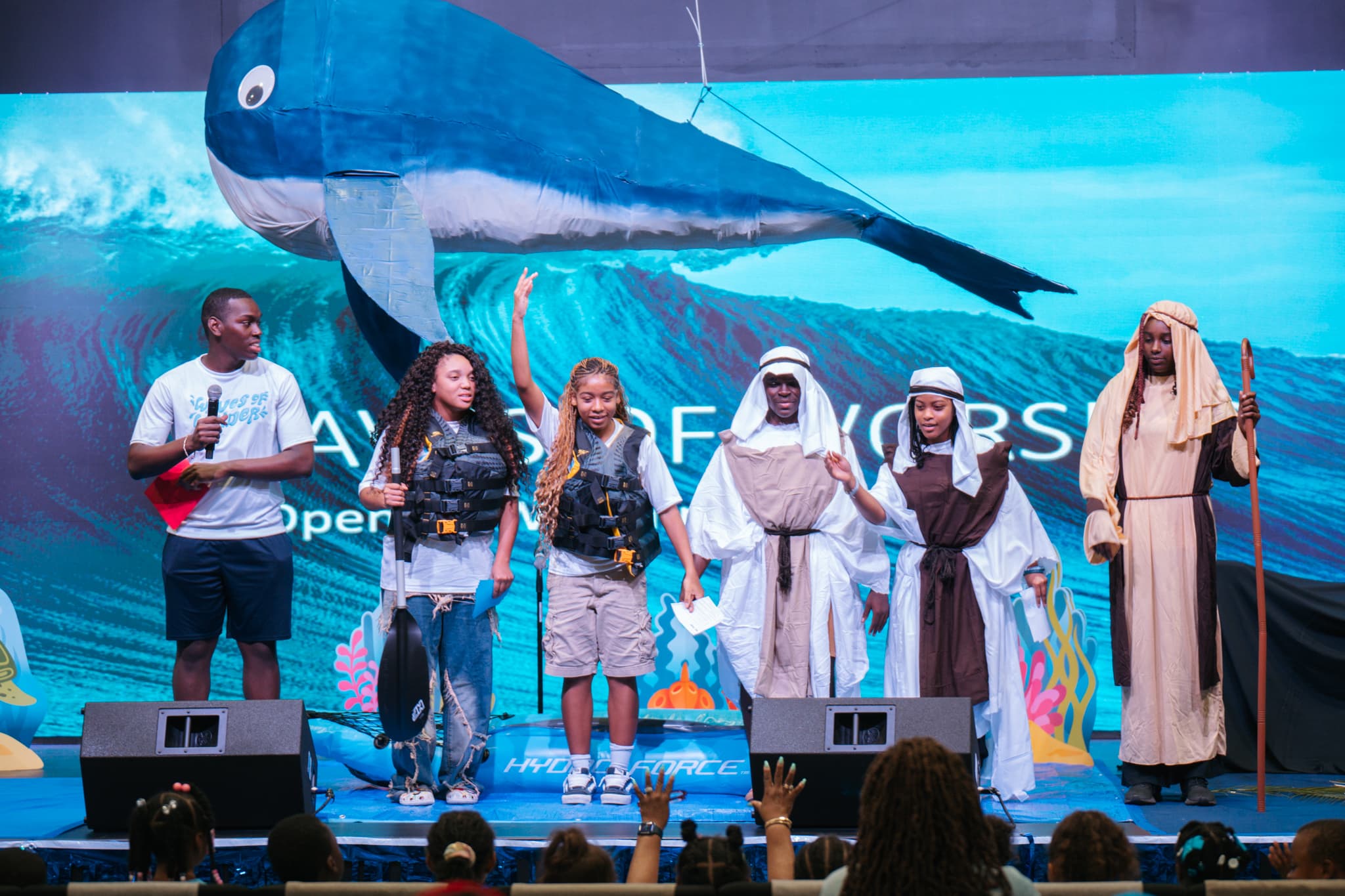 Kids performing on stage at LFCC summer camp
