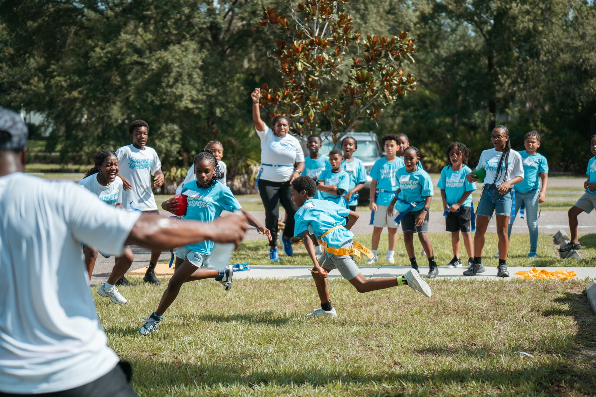 Outdoor flag football game at kids camp Riverview