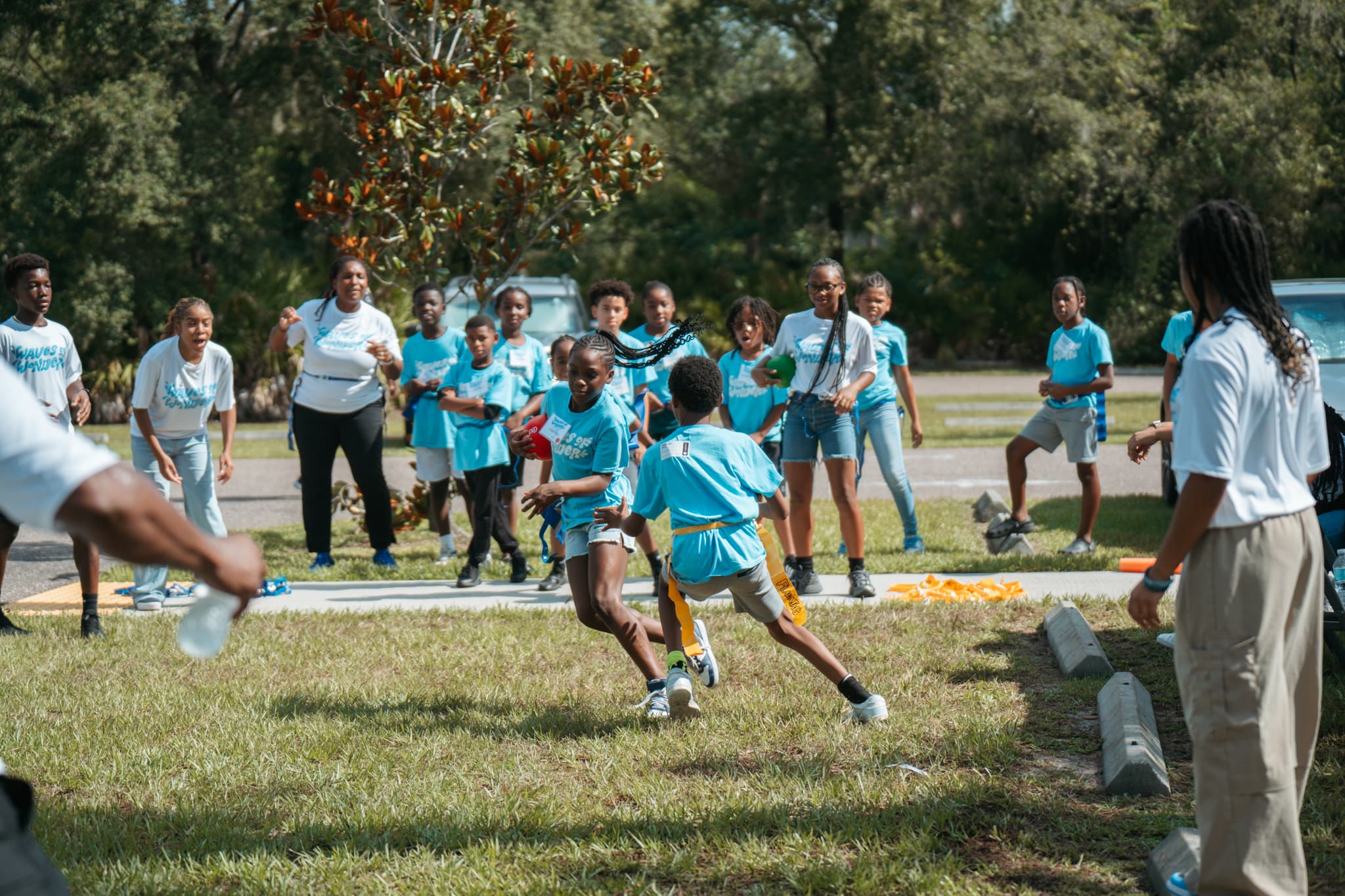 Kids playing flag football at summer camp Riverview FL